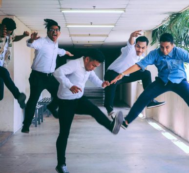 group of people doing jump shot photography